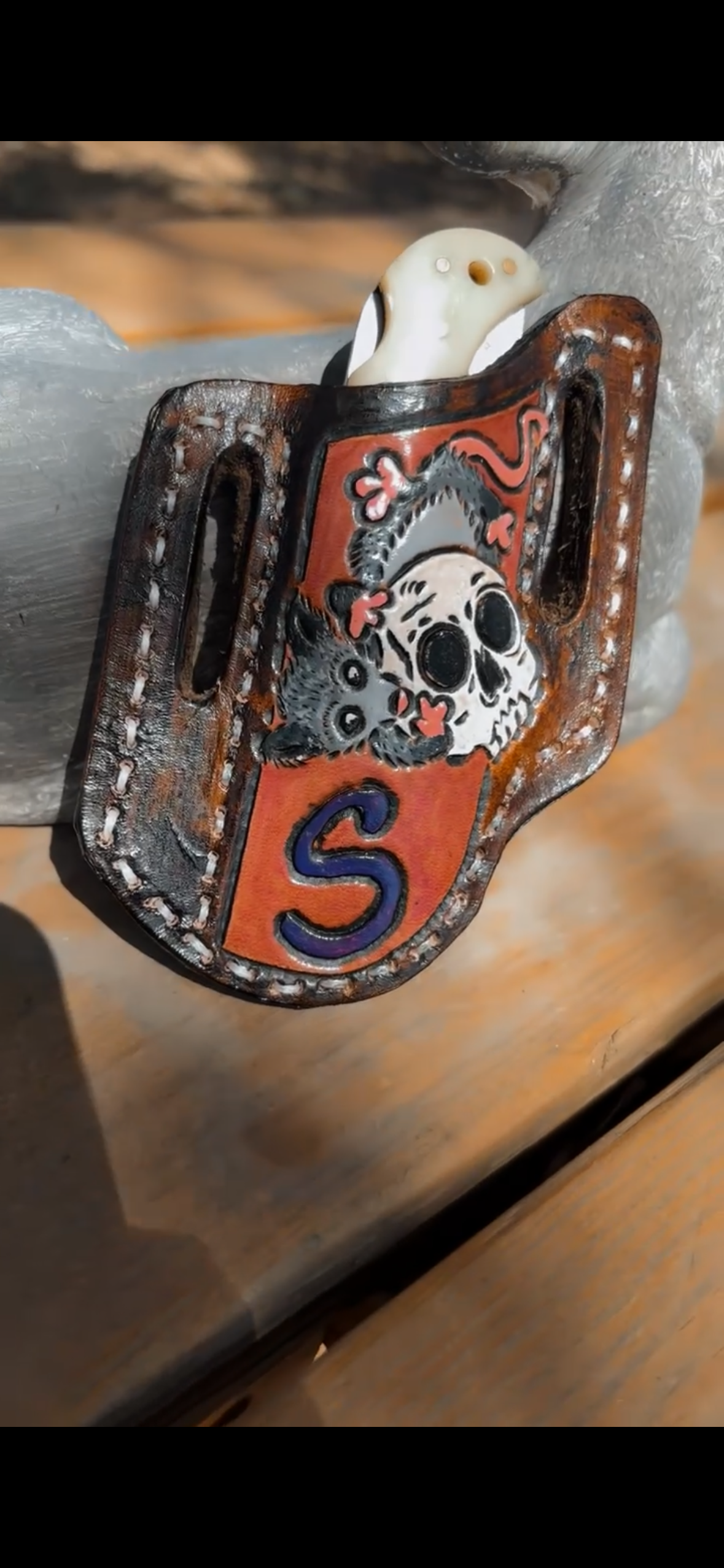 Hand-tooled knife sheath handmade by Outlaw Angel Designs